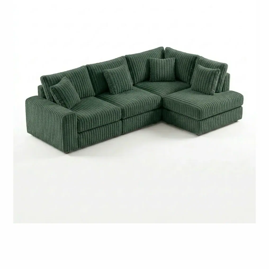 Sofá modular tapizado en pana verde sobre fondo de estudio